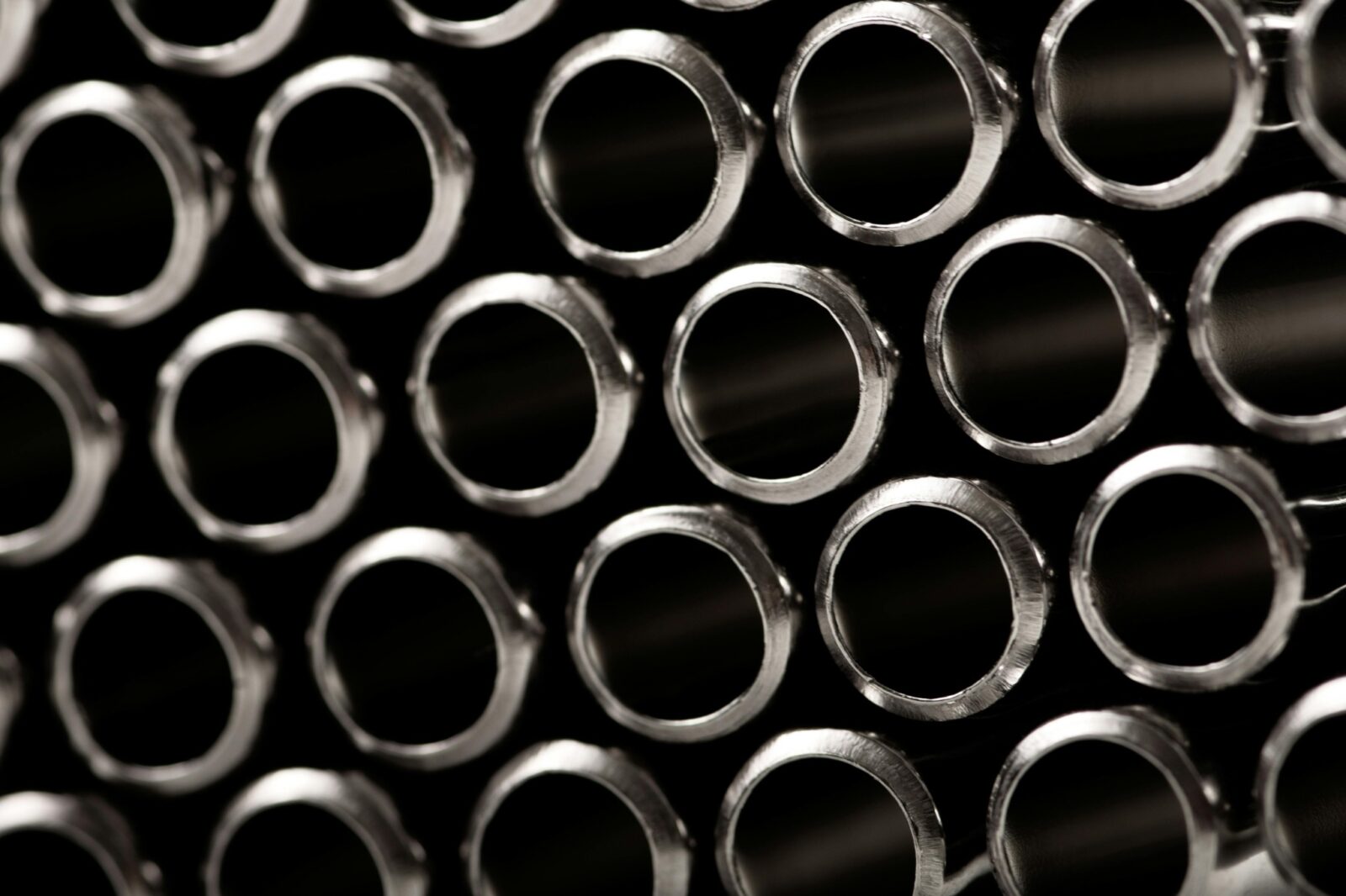 Close-up of stacked steel pipes for industrial construction and fabrication